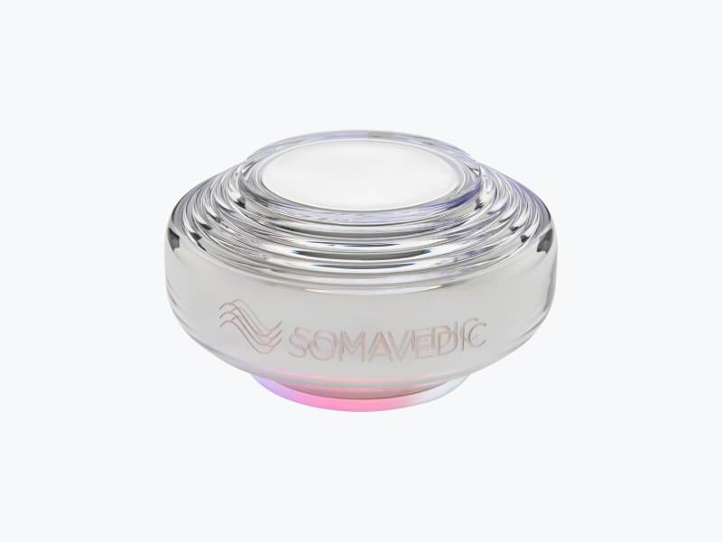 Somavedic Harmony — compact EMF protection device with silver-white glass shell